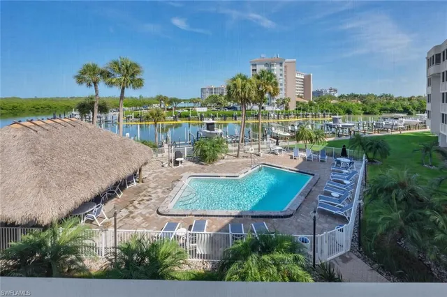 an aerial view of a house with outdoor space and lake view