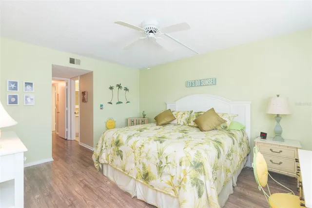 a bedroom with a bed and a table