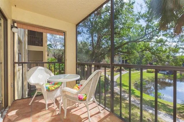 a view of a chairs and table in the balcony