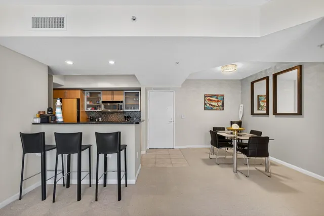 a dining room with furniture and window