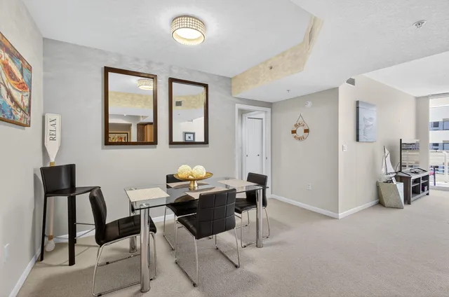 a view of a livingroom with furniture and windows