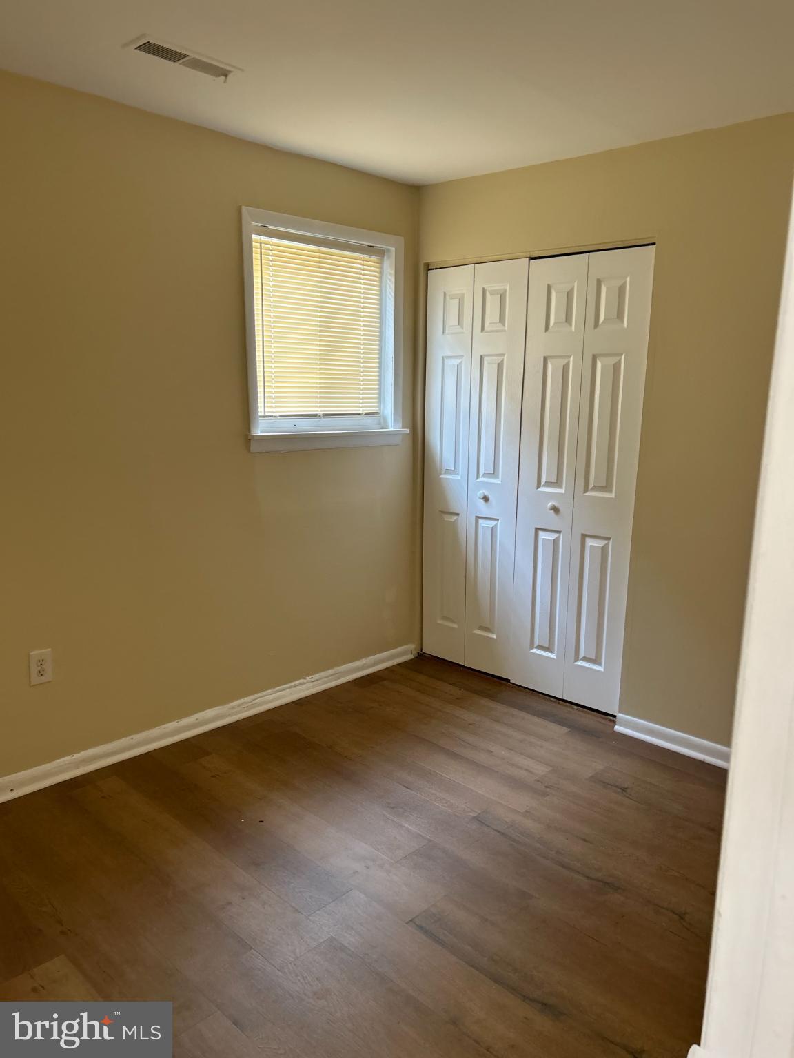 2940 Devereaux Avenue Philadelphia, PA 19149 - Photo 16 of 22 an empty room with wooden floor and windows