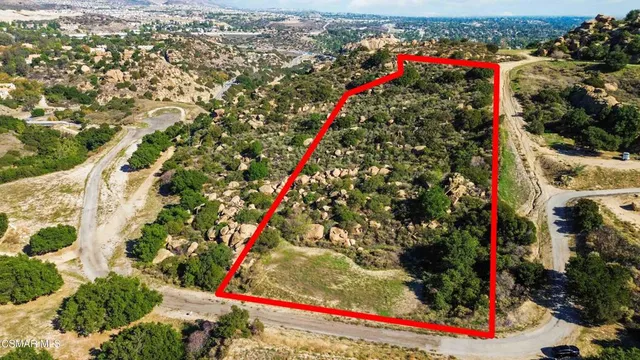 an aerial view of city and lake