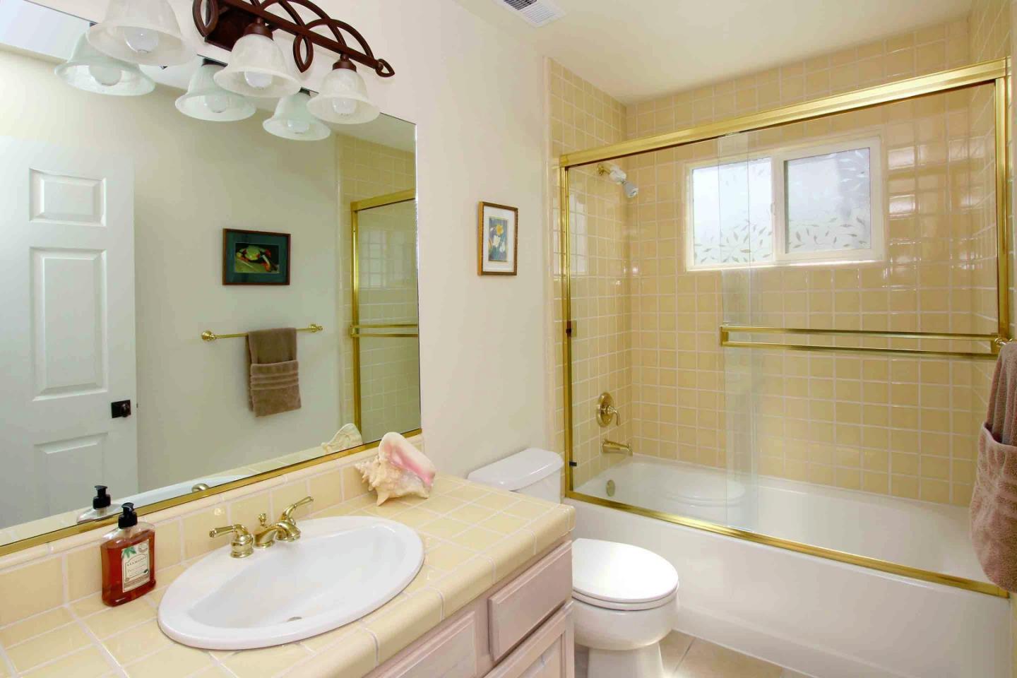 840 Seacliff Drive Aptos, CA 95003 - Photo 11 of 21 a bathroom with a sink a toilet and a mirror