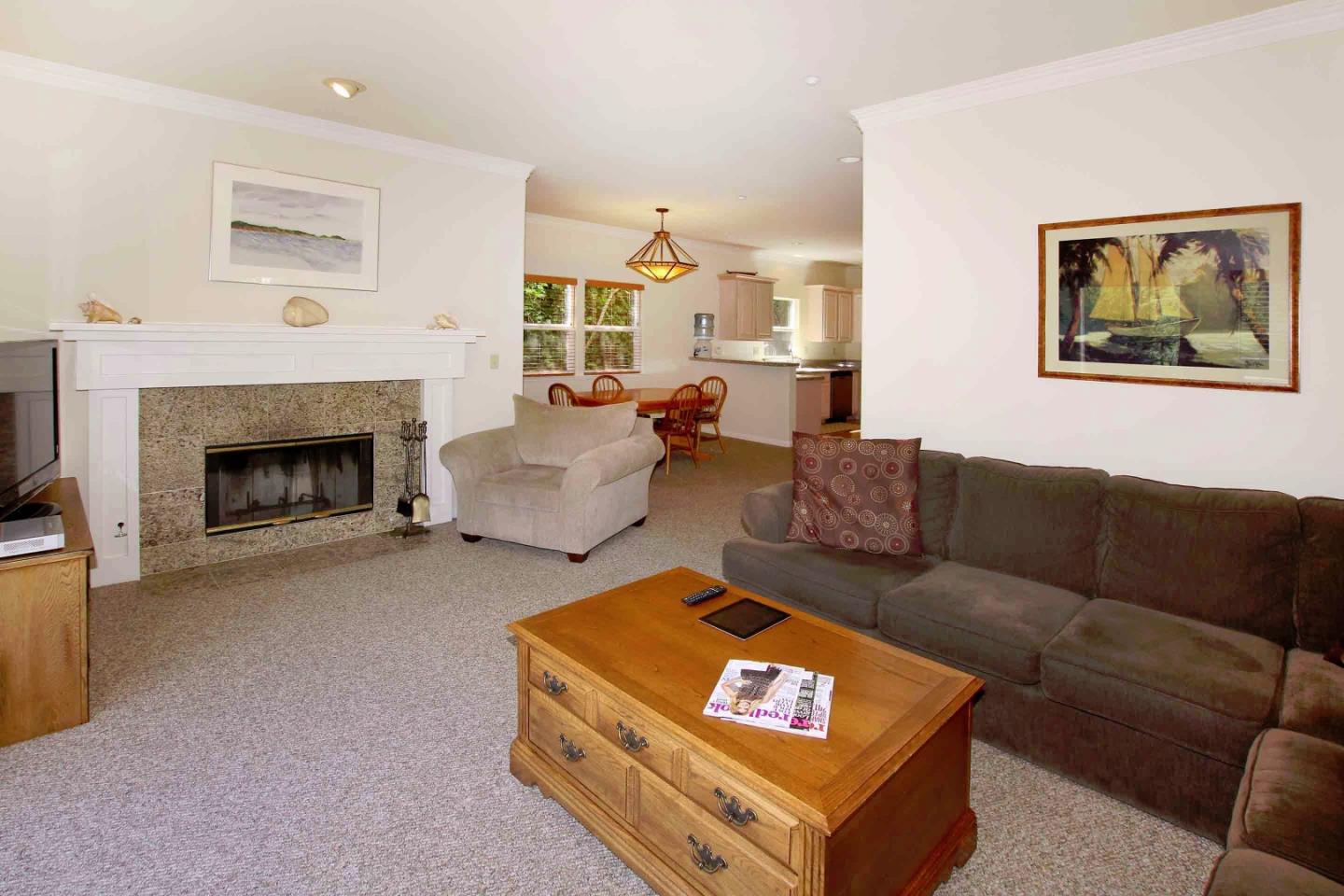 840 Seacliff Drive Aptos, CA 95003 - Photo 7 of 21 a living room with furniture a window and a fireplace