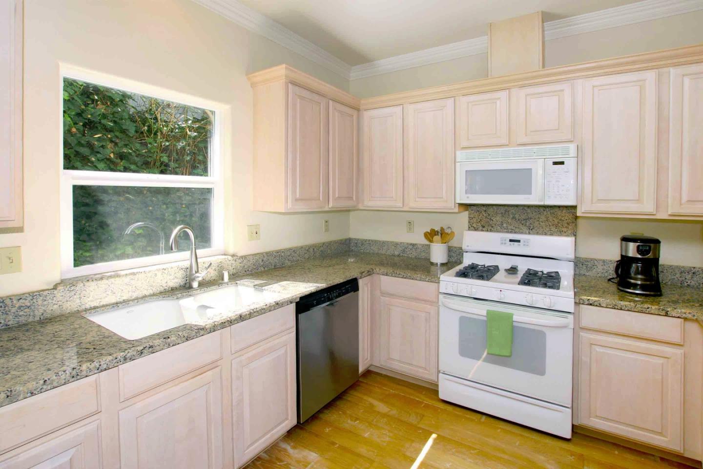 840 Seacliff Drive Aptos, CA 95003 - Photo 10 of 21 a kitchen with granite countertop a sink stove and cabinets