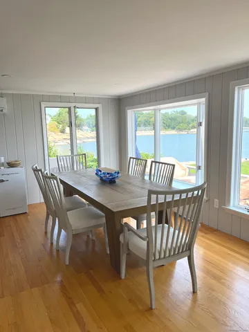 a view of a dining room with furniture window and outside view
