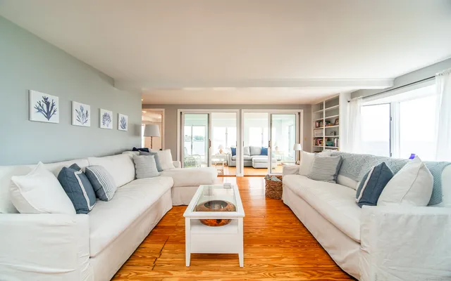 a living room with furniture and a rug