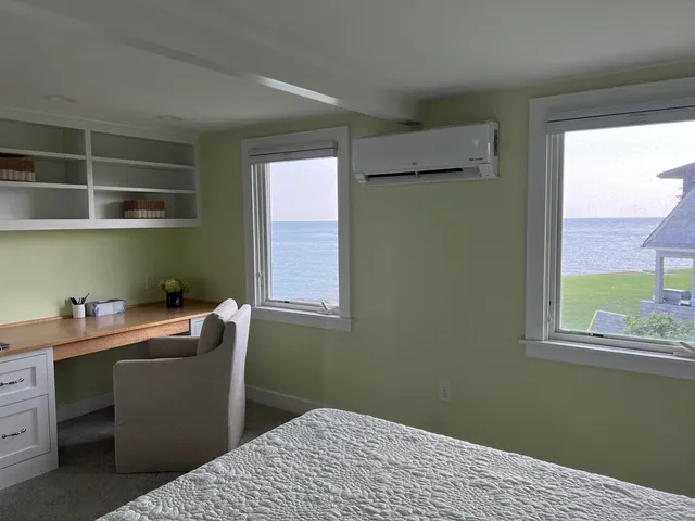 a room with a window and a chair