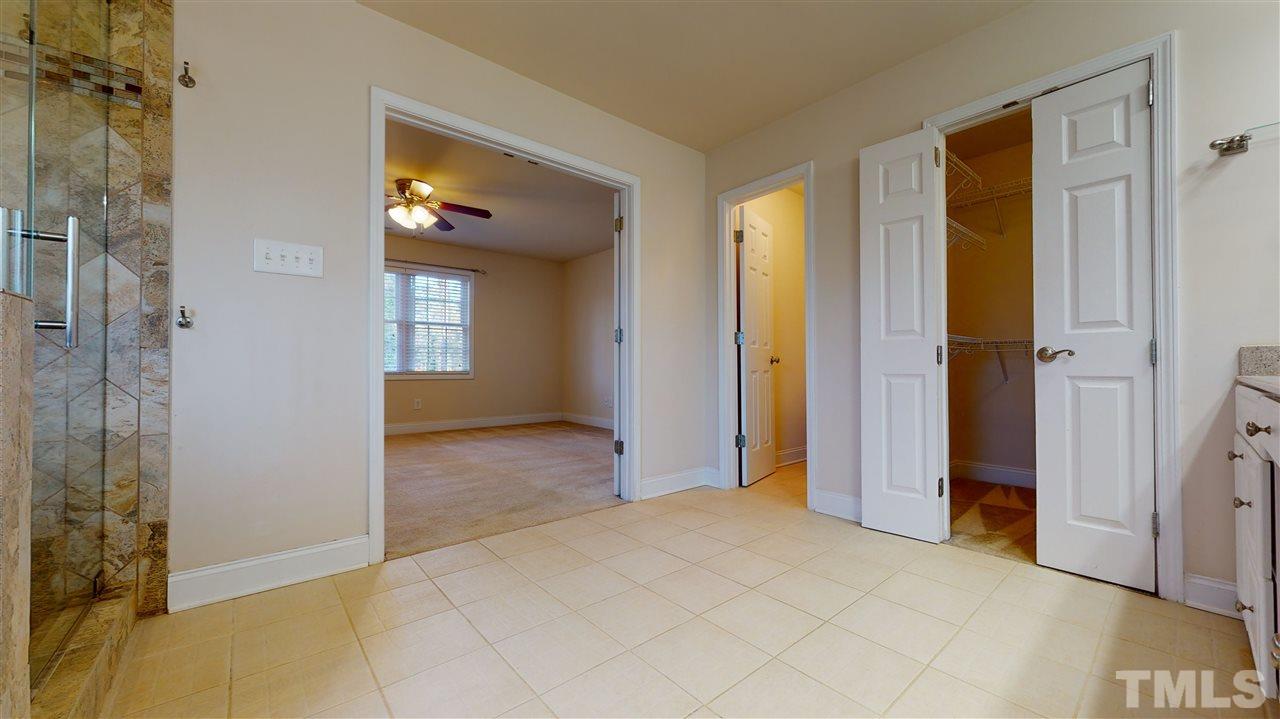 2105 Cook Road Durham, NC 27713 - Photo 13 of 29 a view of a bathroom with a shower and a sink