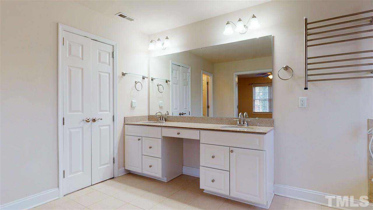2105 Cook Road Durham, NC 27713 - Photo 15 of 29 a spacious bathroom with a granite countertop sink mirror and a