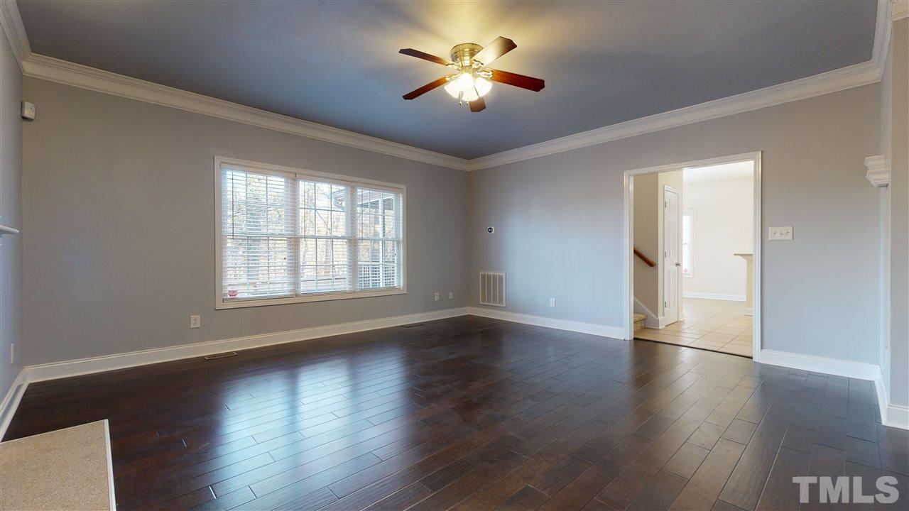 2105 Cook Road Durham, NC 27713 - Photo 20 of 29 a view of empty room with wooden floor and fan