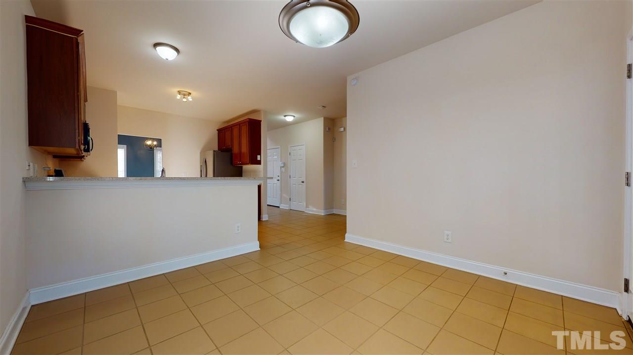 2105 Cook Road Durham, NC 27713 - Photo 24 of 29 a view of a kitchen cabinets and a wooden floor