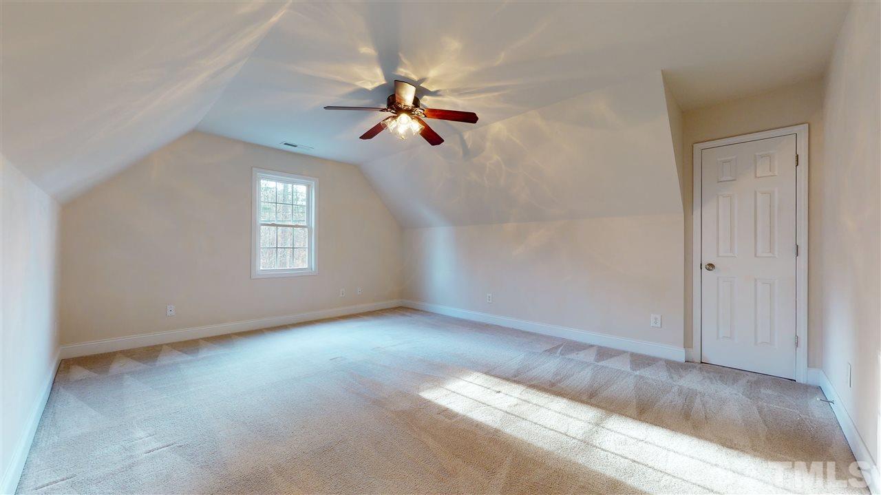2105 Cook Road Durham, NC 27713 - Photo 6 of 29 a view of a livingroom with a ceiling fan and window