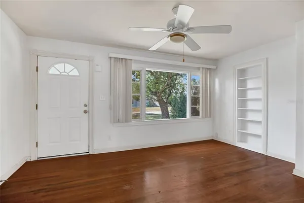 a view of an empty room with a window