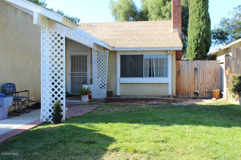 13433 Laurelhurst Road Moorpark, CA 93021 - Photo 1 of 23 a backyard of a house with table and chairs