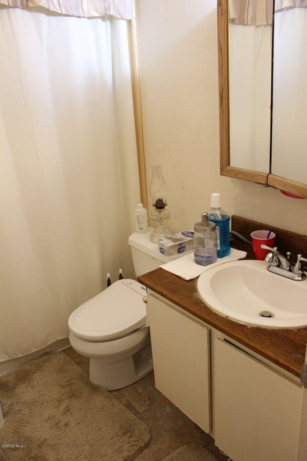 13433 Laurelhurst Road Moorpark, CA 93021 - Photo 11 of 23 a bathroom with a sink and a toilet