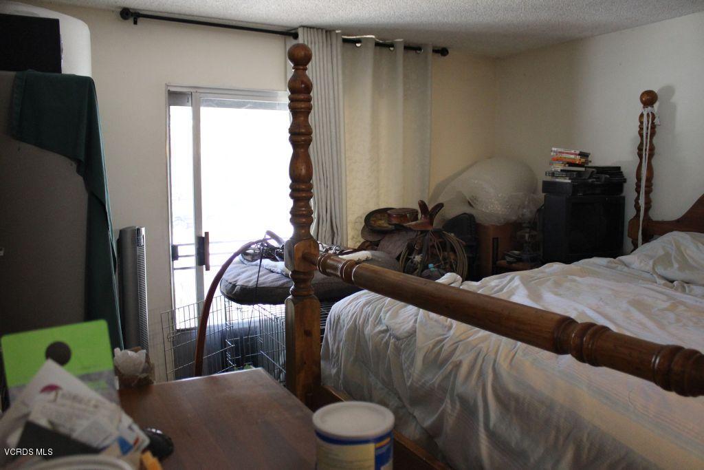 13433 Laurelhurst Road Moorpark, CA 93021 - Photo 17 of 23 a bedroom with a bed and a large mirror