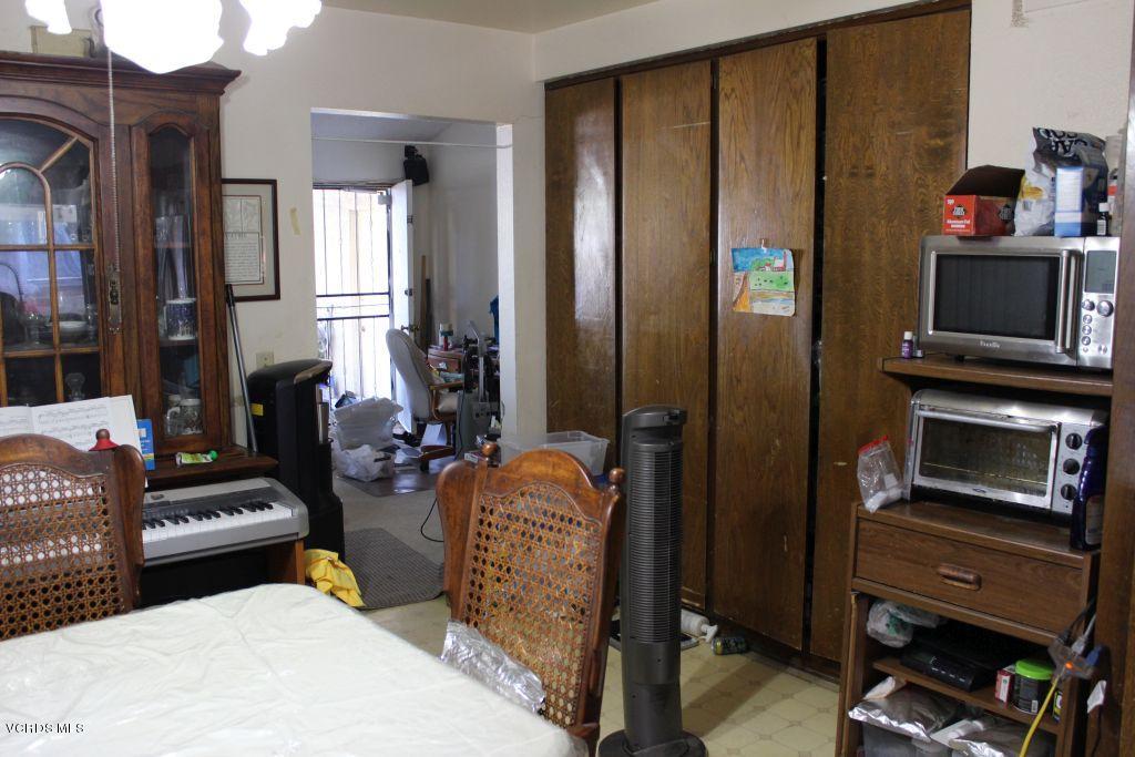 13433 Laurelhurst Road Moorpark, CA 93021 - Photo 5 of 23 a living room with furniture a flat screen tv and a fireplace