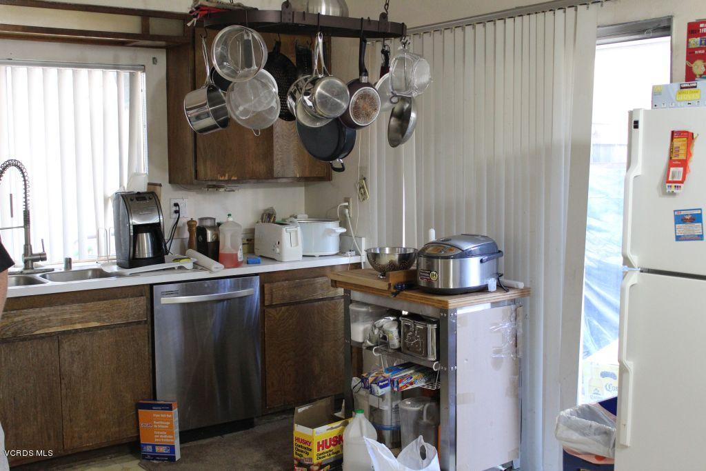 13433 Laurelhurst Road Moorpark, CA 93021 - Photo 8 of 23 a kitchen with a sink and cabinets