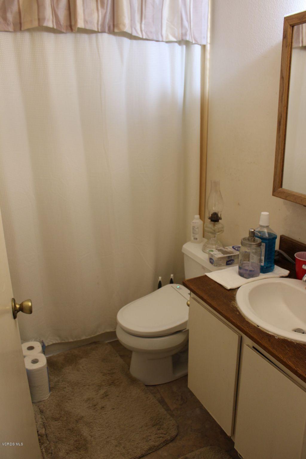 13433 Laurelhurst Road Moorpark, CA 93021 - Photo 10 of 23 a bathroom with a sink and a toilet