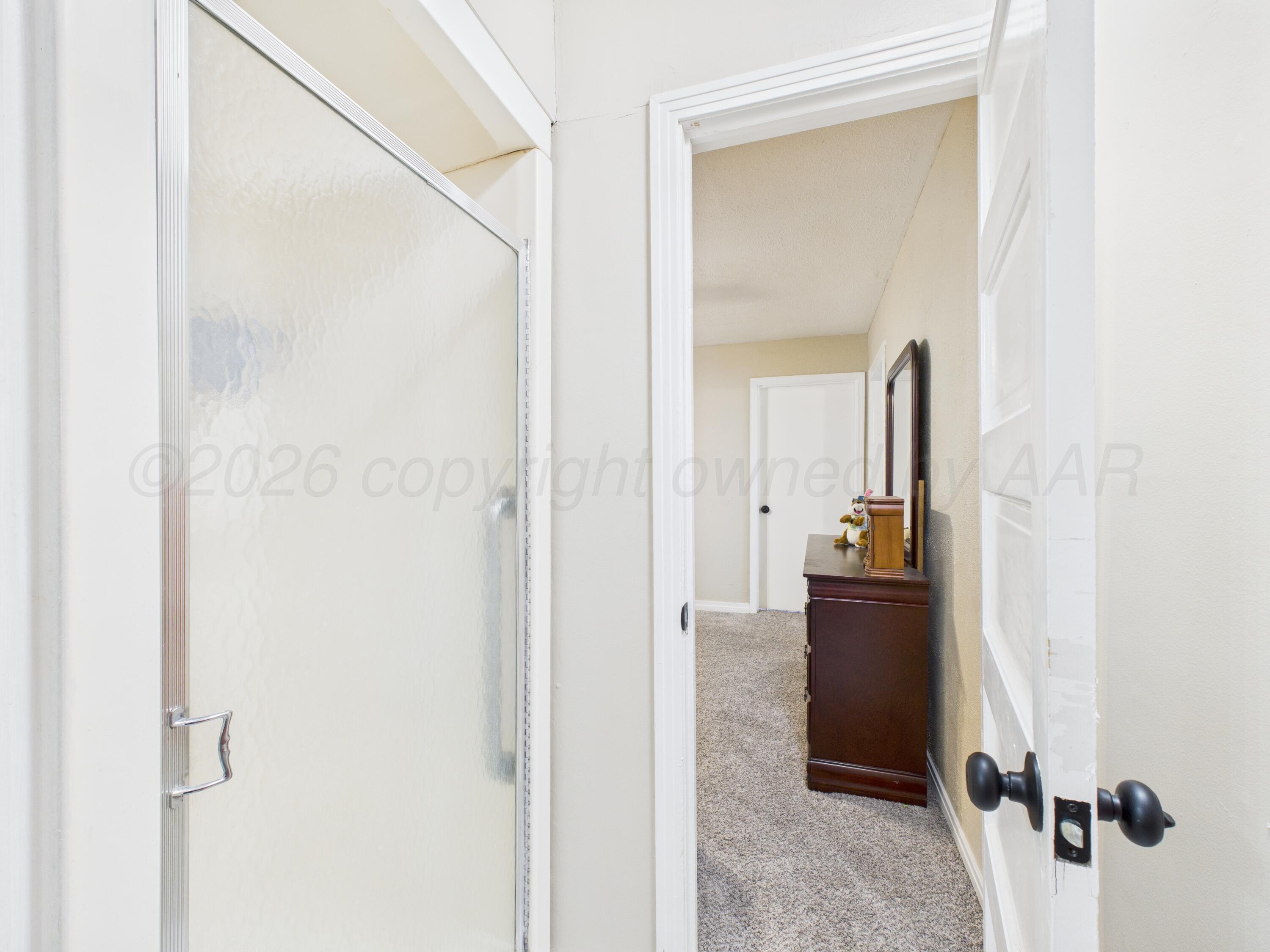 1816 Tularosa Street Amarillo, TX 79102 - Photo 19 of 24 a view of a bathroom from a hallway