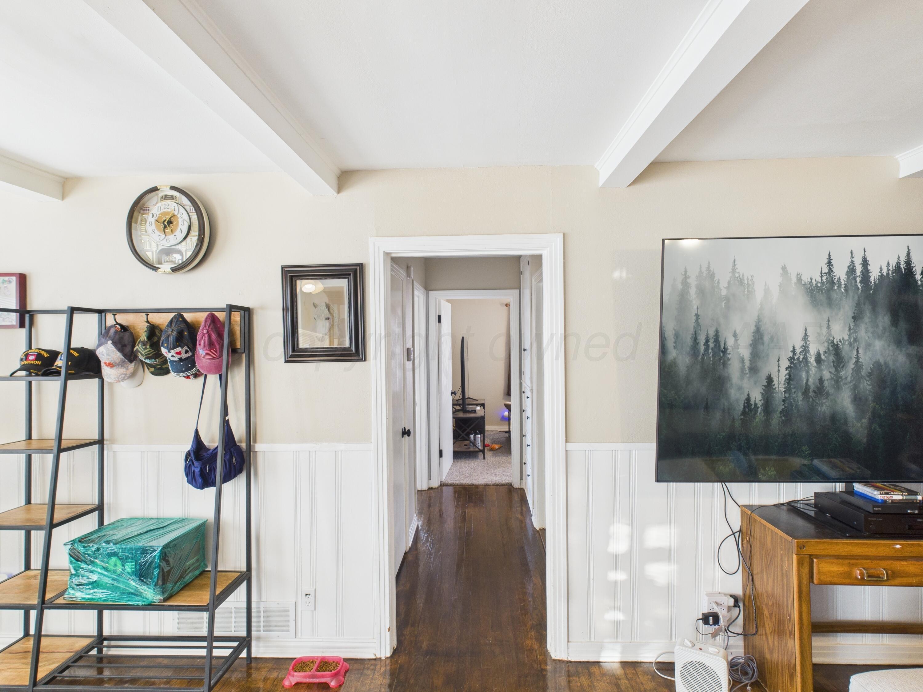 1816 Tularosa Street Amarillo, TX 79102 - Photo 5 of 24 a view of a hallway with wooden floor and door