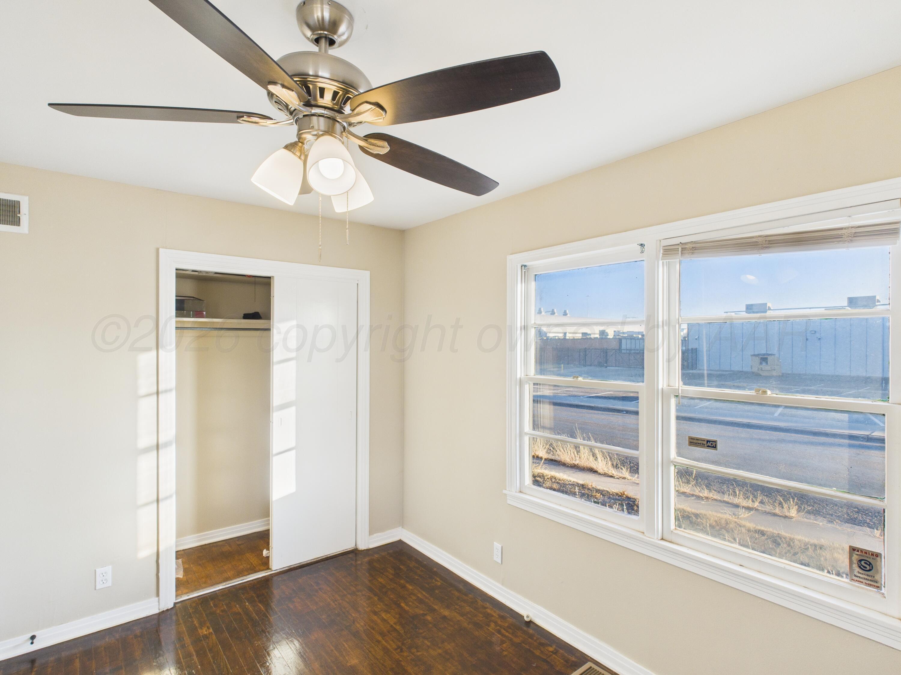 1816 Tularosa Street Amarillo, TX 79102 - Photo 9 of 24 a view of an empty room with a window