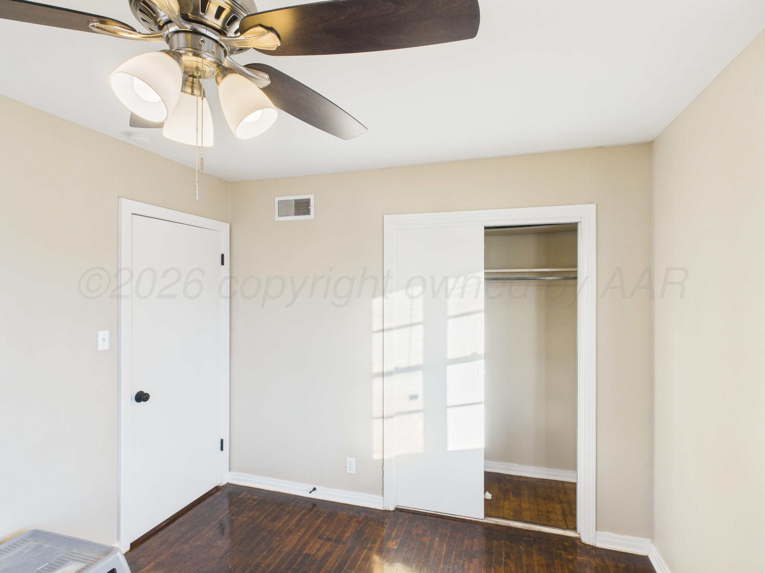 1816 Tularosa Street Amarillo, TX 79102 - Photo 10 of 24 a view of empty room with wooden floor