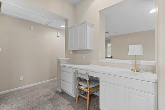 a kitchen with cabinets appliances and a sink