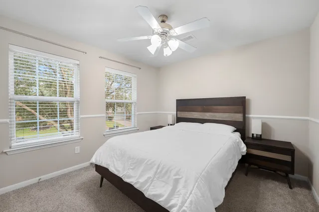 a bedroom with a bed and window