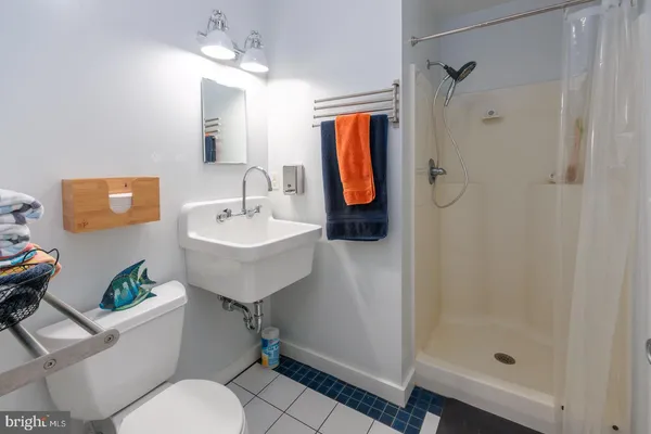 a living room with furniture a flat screen tv and a rug