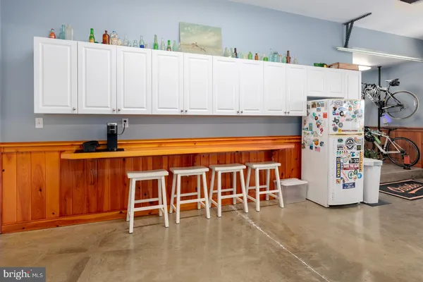 a kitchen with stainless steel appliances a stove a sink and a microwave