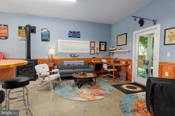 a kitchen with stainless steel appliances granite countertop wooden cabinets a stove a sink and a window