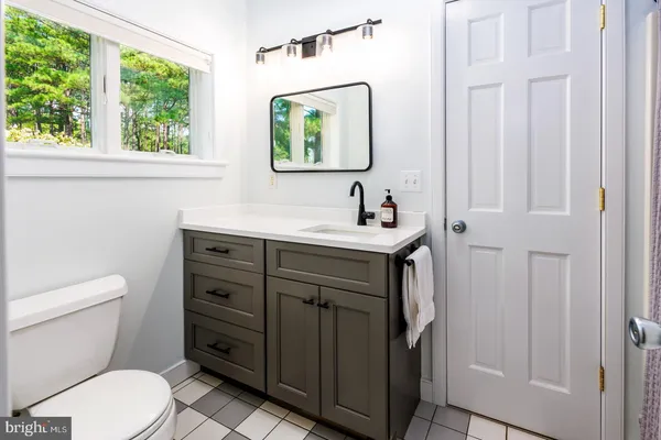 a bedroom with furniture and a flat screen tv