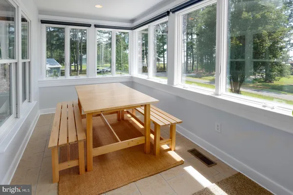 a view of a lake with lawn chairs