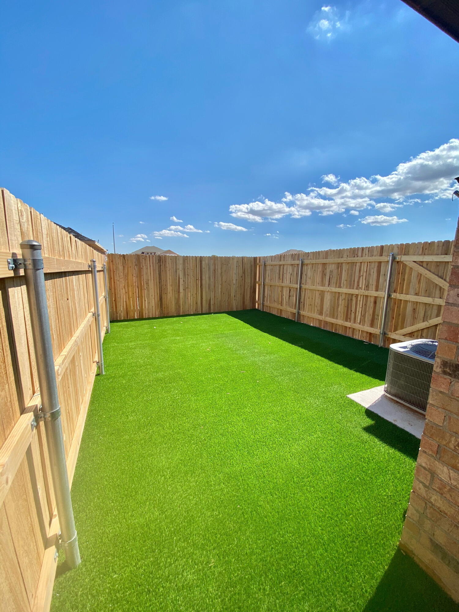 2725 137th Street Lubbock, TX 79423 - Photo 16 of 17 a view of yard with swimming pool and wooden fence