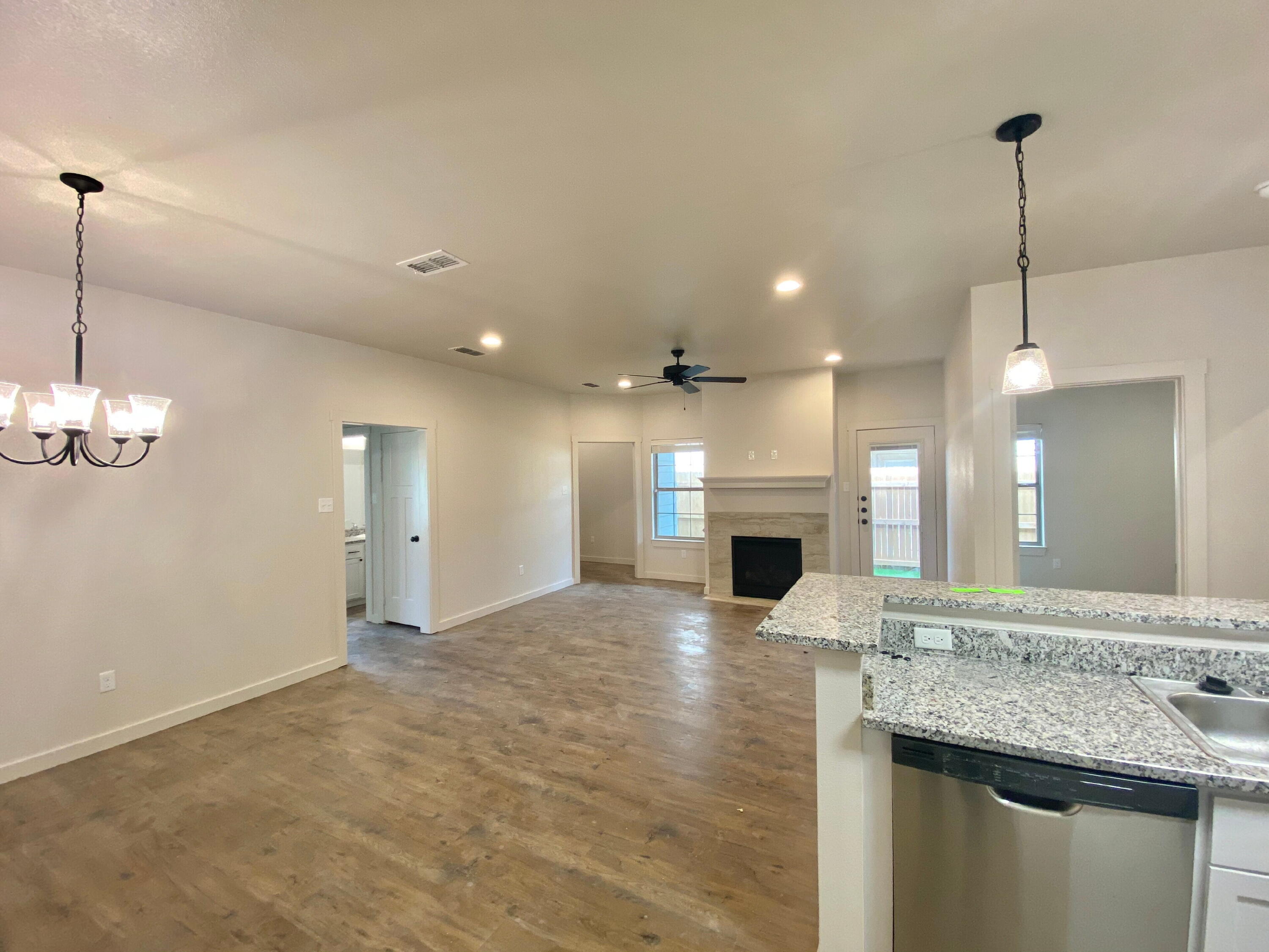 2725 137th Street Lubbock, TX 79423 - Photo 2 of 17 a view of a kitchen with a sink and chandelier