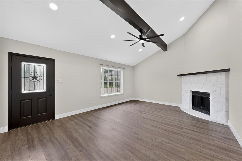 7729 Misty Ridge Drive North Fort Worth, TX 76137 - Photo 3 of 30 wooden floor in an empty room with a window
