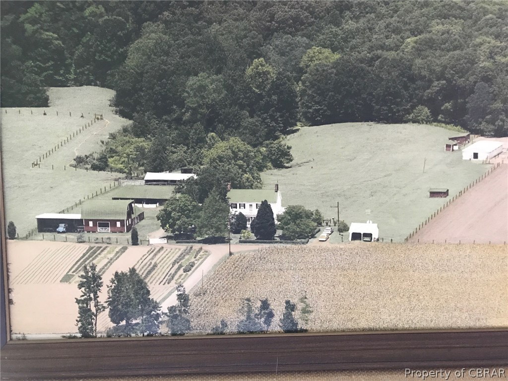 1943 Browns Store Road Heathsville, VA 22473 - Photo 6 of 6 This is a aerial that was taken in 1990 when the farm raised pigs and the furrowing houses, some of these buildings and fence are no longer there. Property has a small pond back in the woods.
