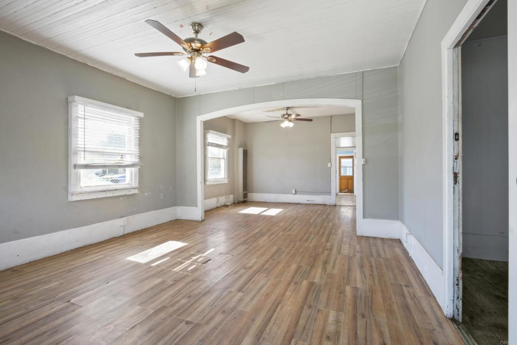 12940 Fourth Street Chino, CA 91710 - Photo 2 of 11 wooden floor in an empty room with a window