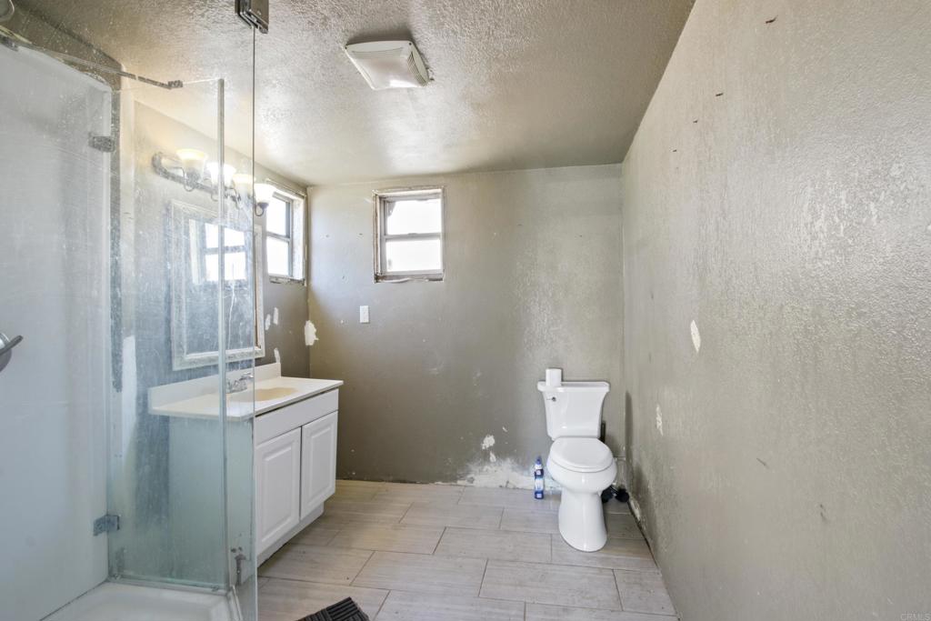 12940 Fourth Street Chino, CA 91710 - Photo 4 of 11 a bathroom with a sink a toilet and shower