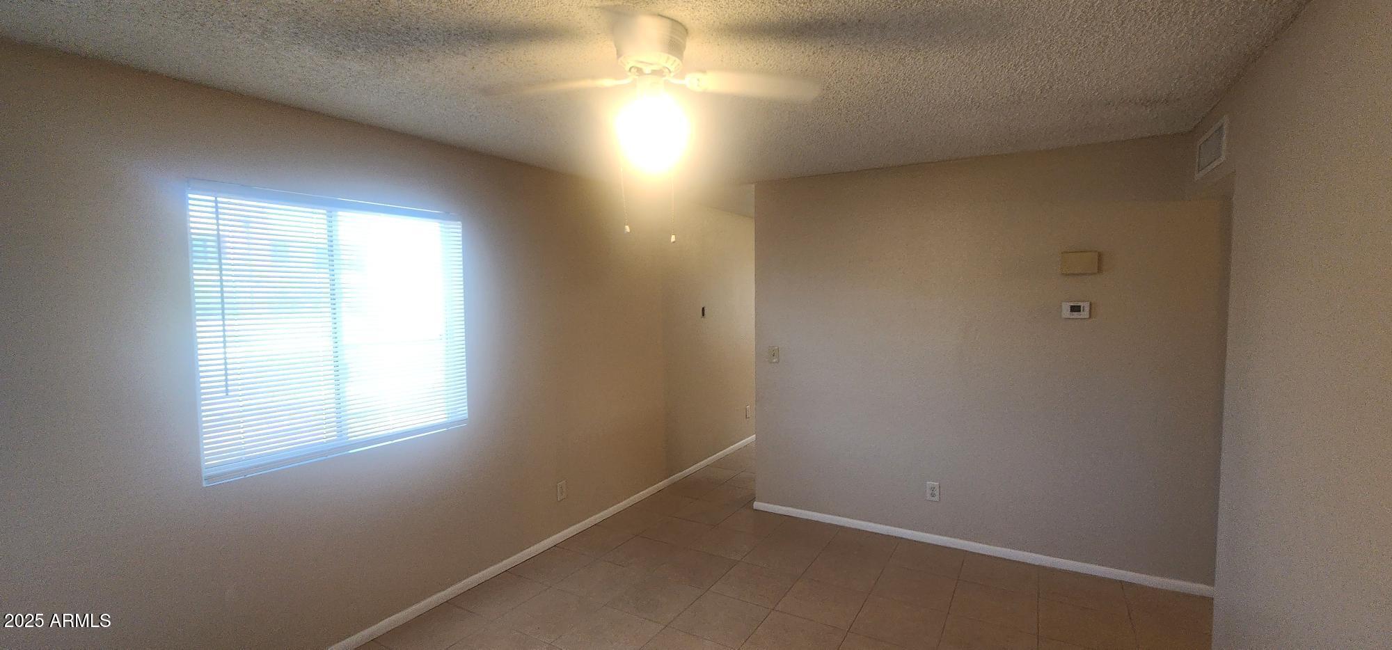 8322 North 60th Avenue, Unit 1 Glendale, AZ 85302 - Photo 28 of 37 an empty room with a window