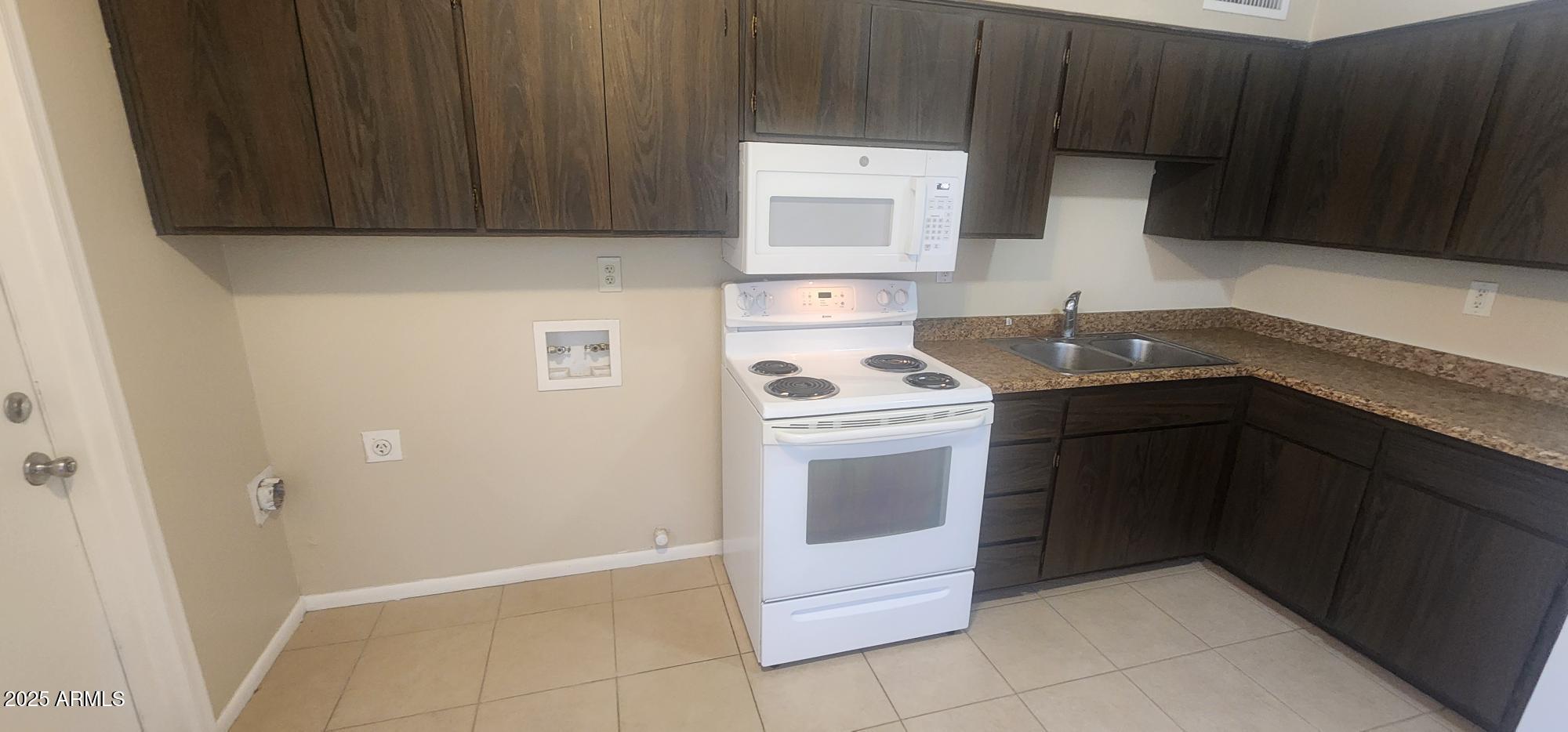8322 North 60th Avenue, Unit 1 Glendale, AZ 85302 - Photo 30 of 37 a kitchen with a sink and a stove top oven