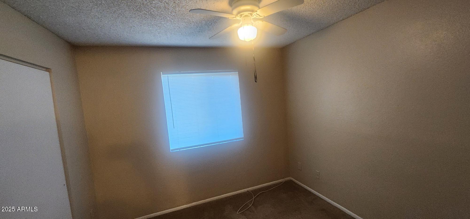 8322 North 60th Avenue, Unit 1 Glendale, AZ 85302 - Photo 32 of 37 a view of an empty room and window
