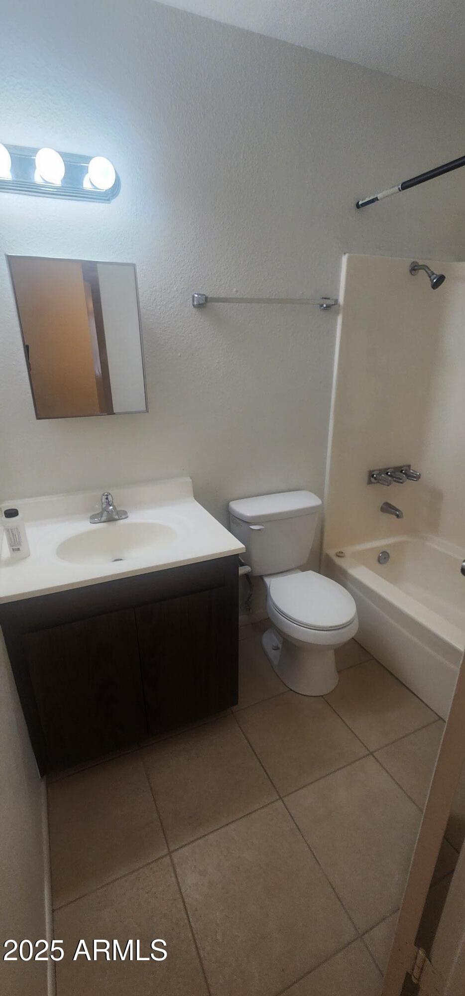 8322 North 60th Avenue, Unit 1 Glendale, AZ 85302 - Photo 34 of 37 a bathroom with a sink a toilet and a bathtub