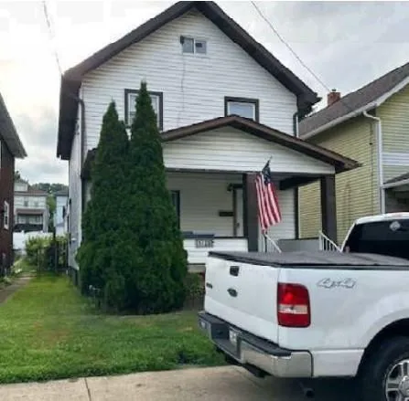 a view of electric house and a yard