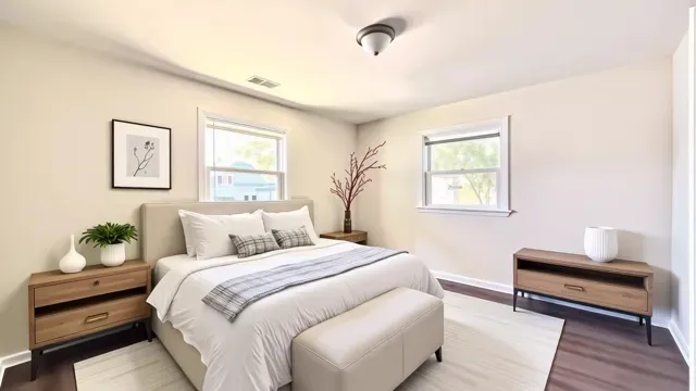 a bedroom with a bed and a night stand