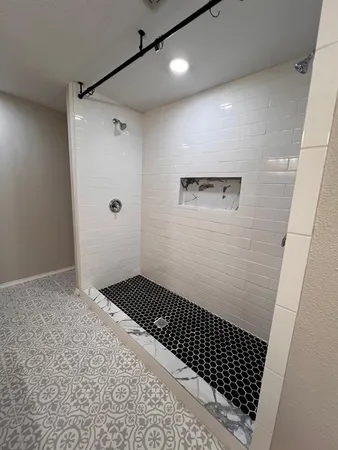 a bathroom with a sink a toilet and a shower