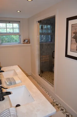 a bathroom with a bathtub and shower